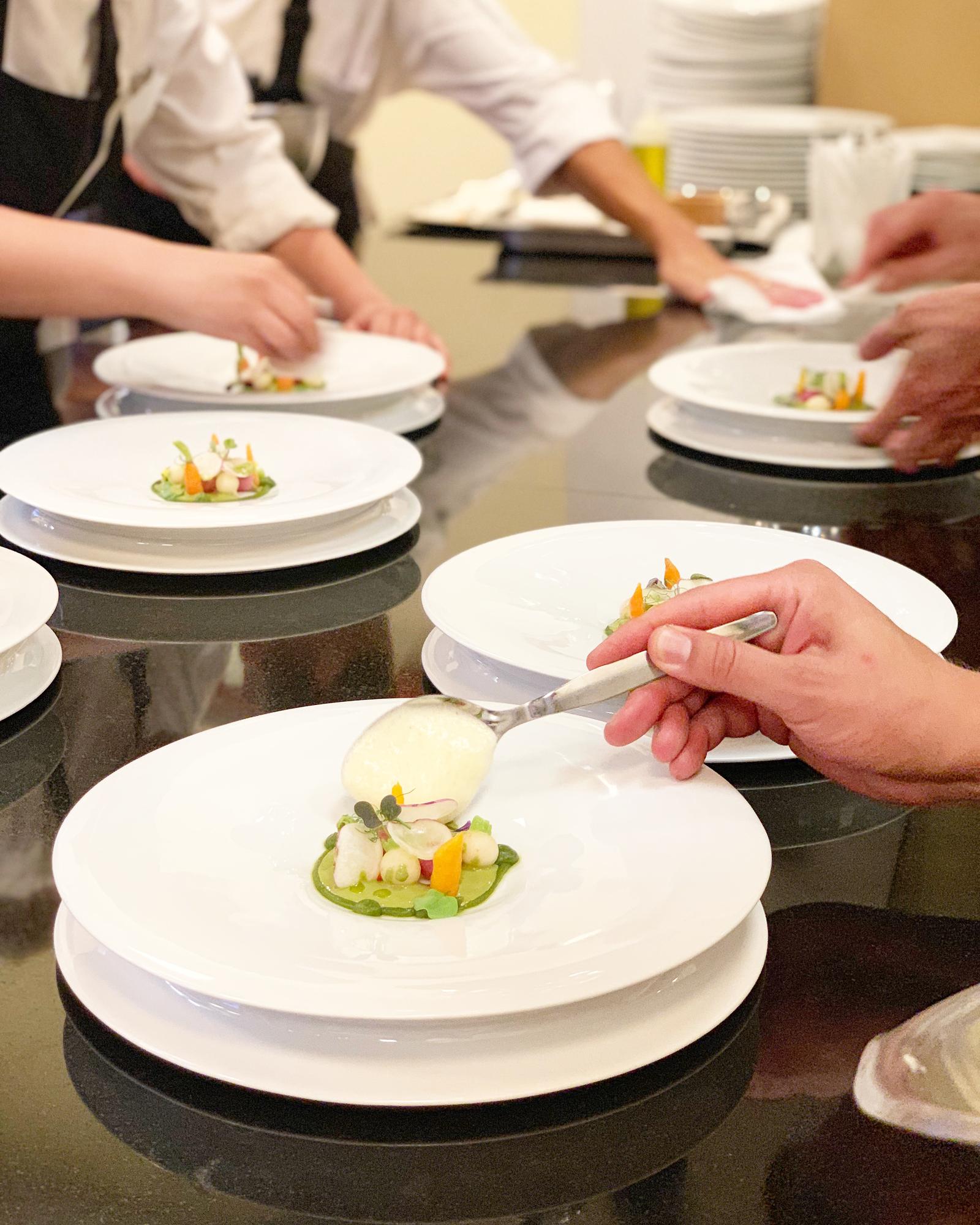Workshop participants plating dishes